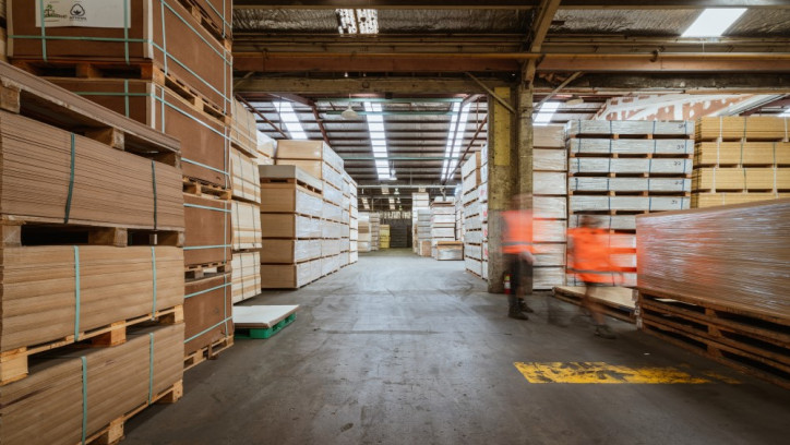 Inside of an importer or manufacturer's warehouse showing stacks of building supplies on pallets.
