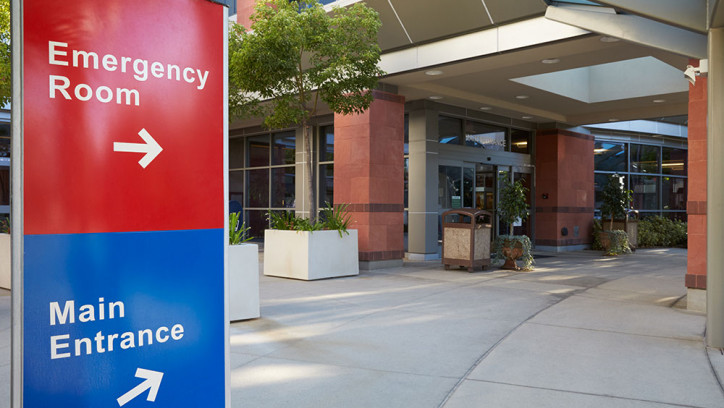 Main entrance to a hospital building with signs