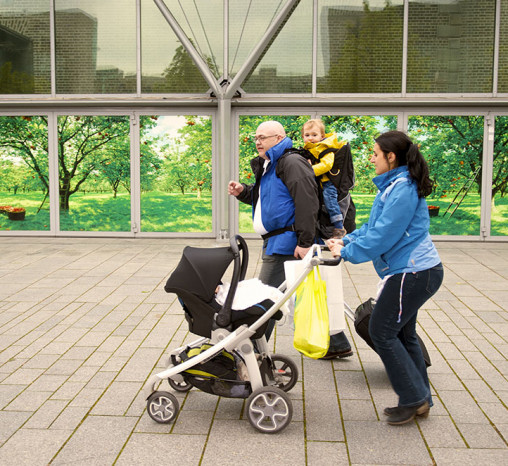 Family walking with a baby buggy