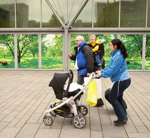 Family walking with a baby buggy