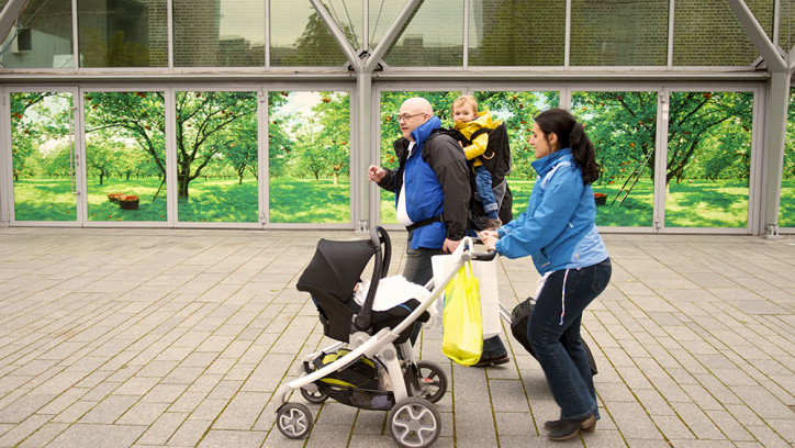 Family walking with a baby buggy