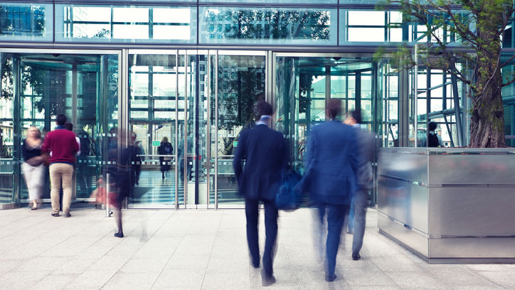 People entering and leaving a building