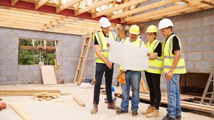 Construction workers looking at plans