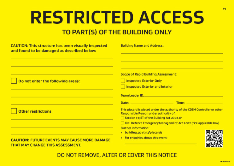 An image showing a rapid building assessment yellow placard - access to the building is restricted to parts of the building.