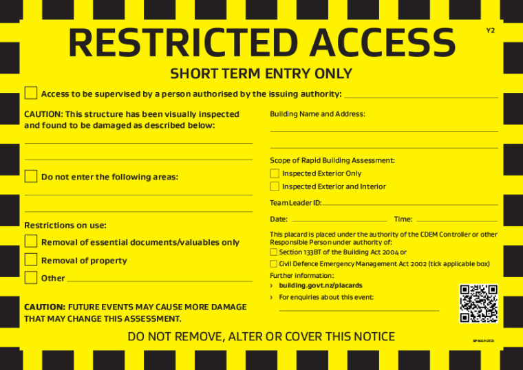 An image showing a rapid building assessment yellow placard - access to the building is restricted to short term entry only.