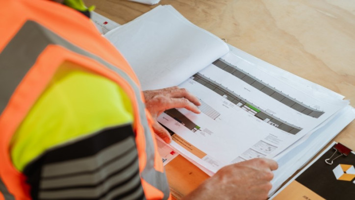 Over the shoulder view of a person reviewing a technical document.
