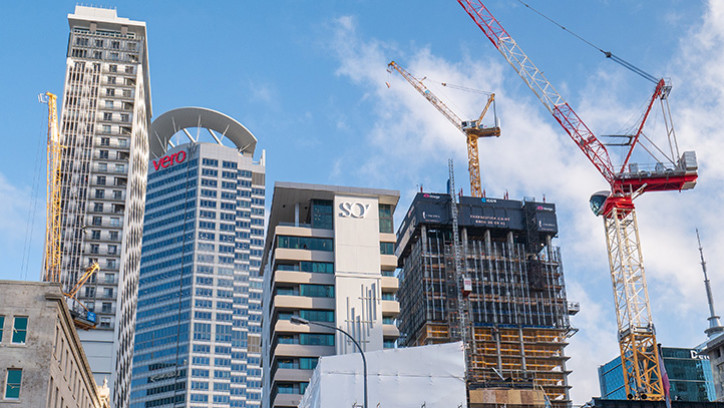 Cranes and high-rise buildings in Auckland.