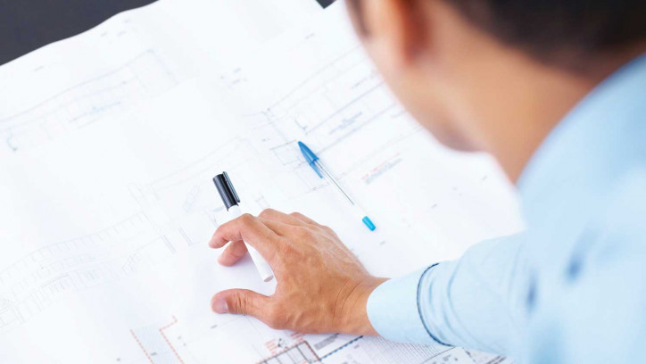 Building professional with design plans